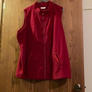 Red fleece vest with sequined pockets.